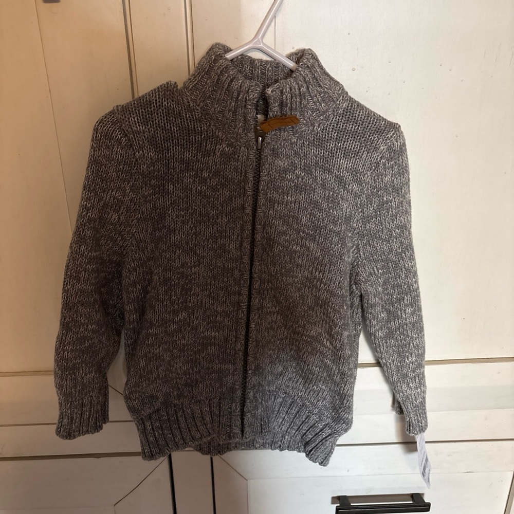 Carter's 2t full zip up gray knitted sweater.
New with Tags
